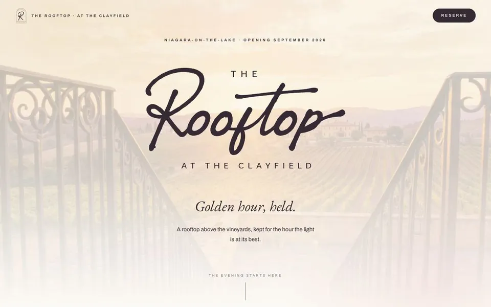 The Rooftop homepage, script wordmark over a cream vineyard sunrise
